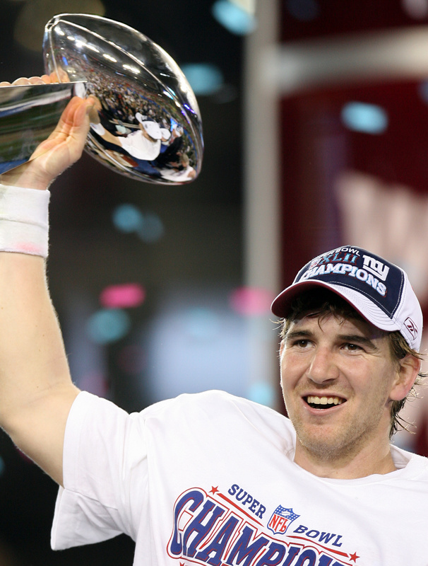 Eli Manning Holding Superbowl Trophy